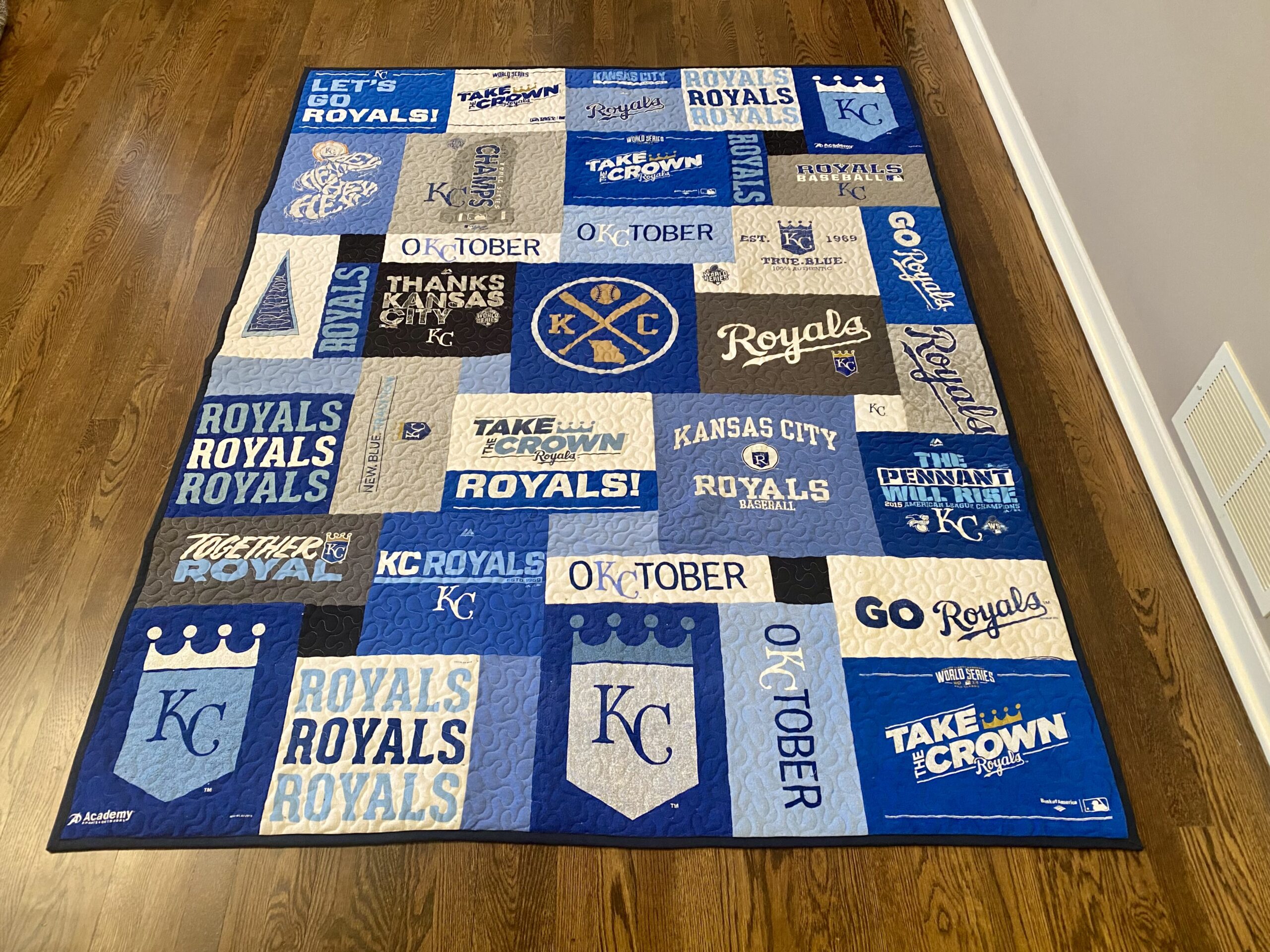 A rug with all the teams logos on it
